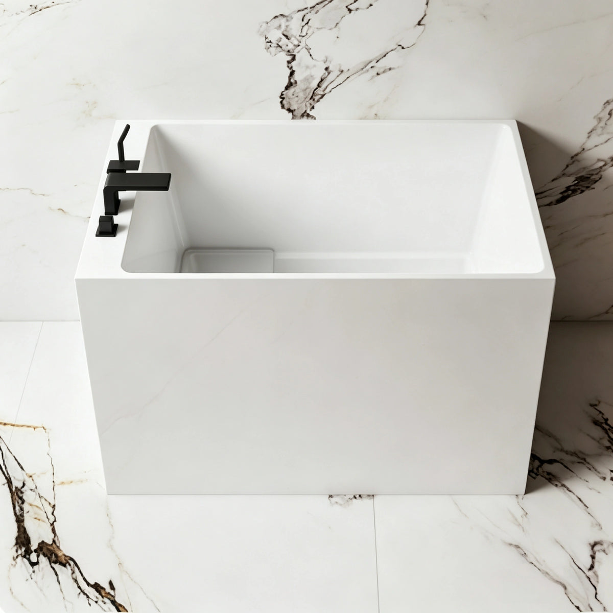 Front bathroom view of the compact glossy white back-to-wall bathtub.