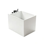 Three-quarter view of the 43-inch glossy white acrylic back-to-wall bathtub.