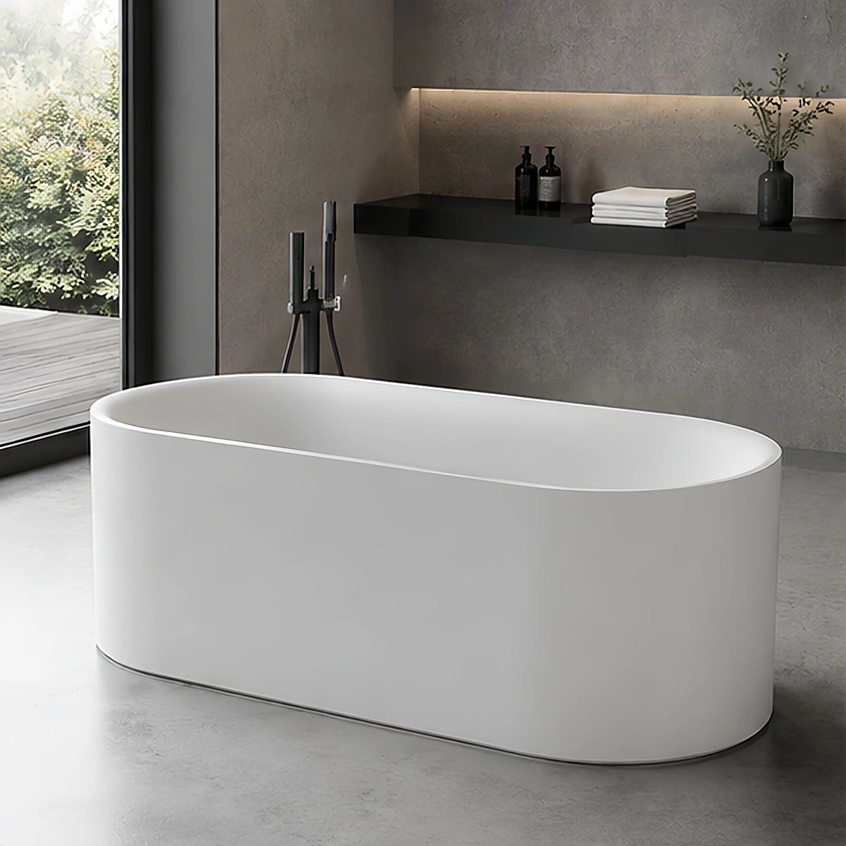 Angled bathroom view of the elongated oval freestanding bathtub.