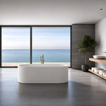 Elongated oval freestanding bathtub in a modern ocean-view bathroom.