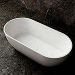 Angled view into the thin-rim matte white freestanding bathtub.
