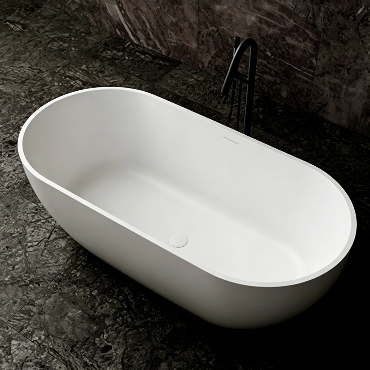 Angled view into the thin-rim matte white freestanding bathtub.