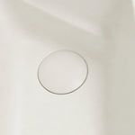 Close-up of the color-matched drain inside the rectangular fluted bathtub.