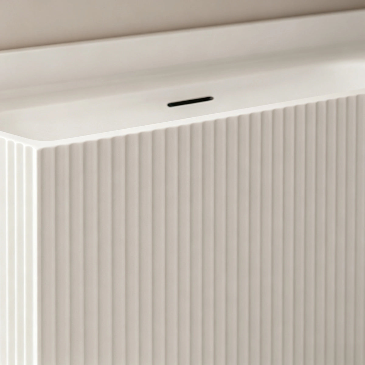 Close-up of the vertical fluting and slot overflow.