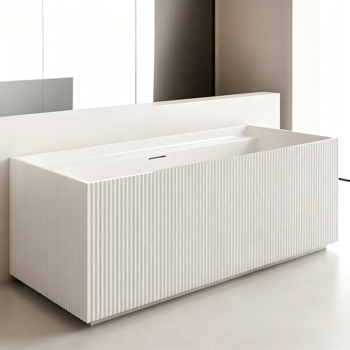 Front bathroom view of the glossy white rectangular fluted bathtub.