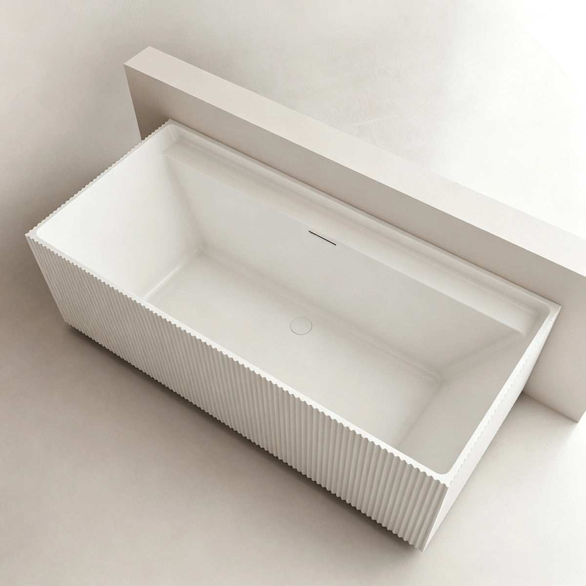 Top view into the rectangular fluted bathtub basin.