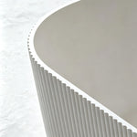 Close-up of the curved basin, narrow rim and slot overflow.