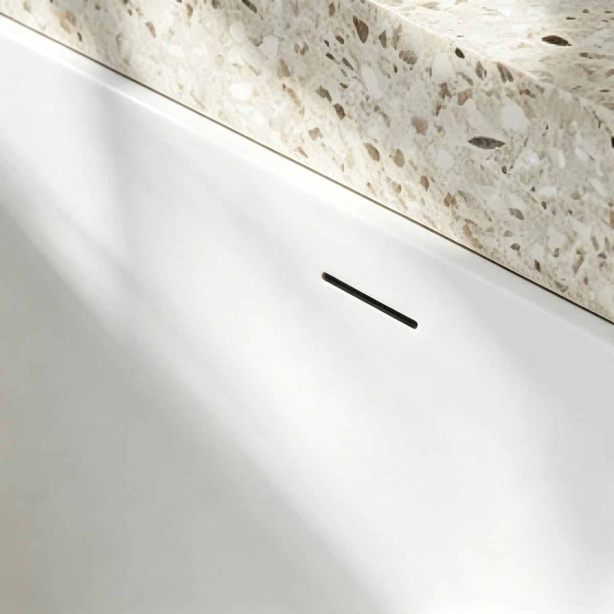 Close-up of the ribbed exterior and rounded bathtub rim.