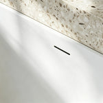 Close-up of the ribbed exterior and rounded bathtub rim.