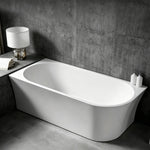 Angled view of the tapered bathtub installed against a wall.
