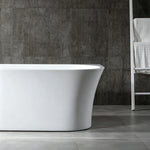 Side profile showing the tapered exterior of the glossy white bathtub.