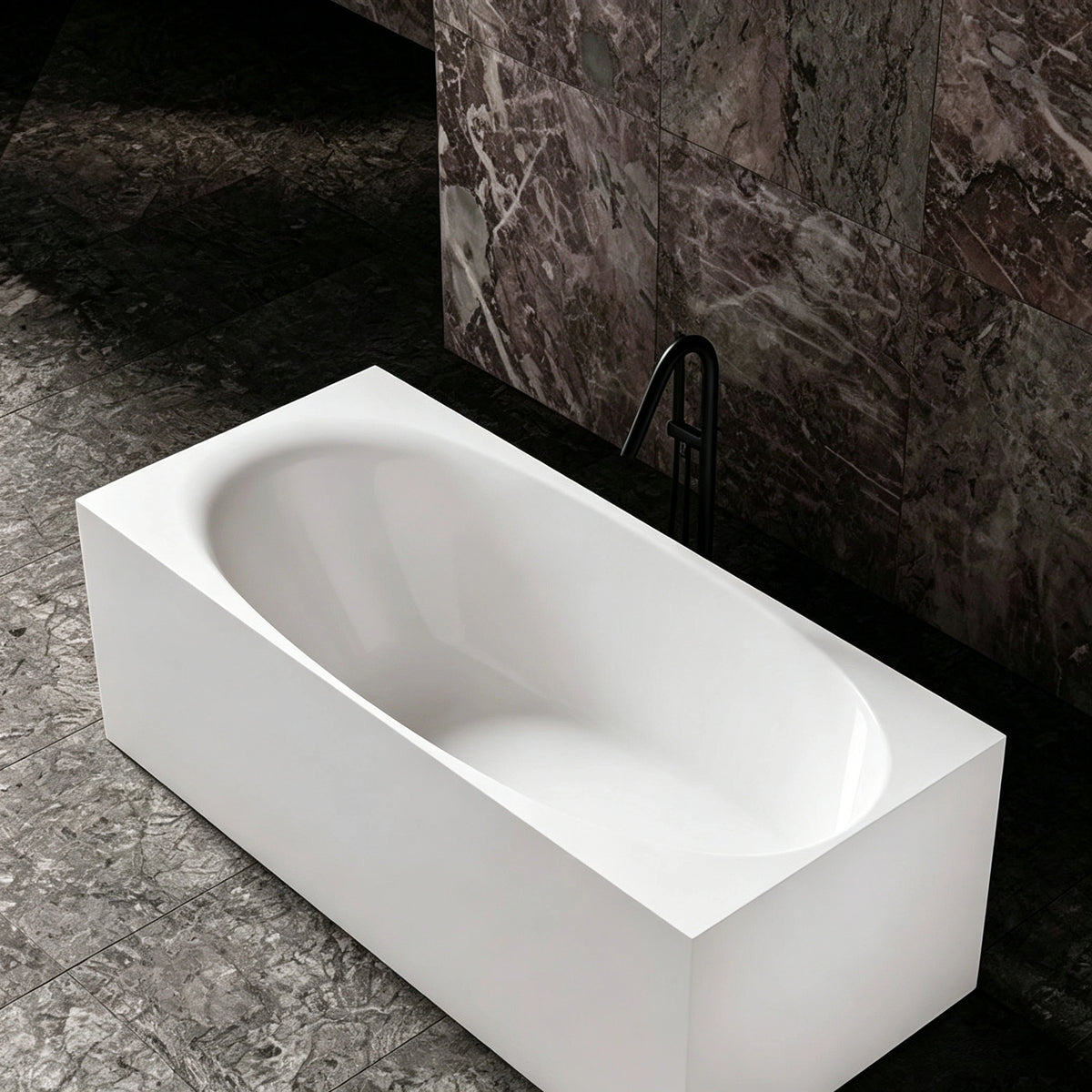 Angled bathroom view into the wide-rim rectangular bathtub.