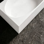 Close-up of the color-matched drain and wide rectangular rim.