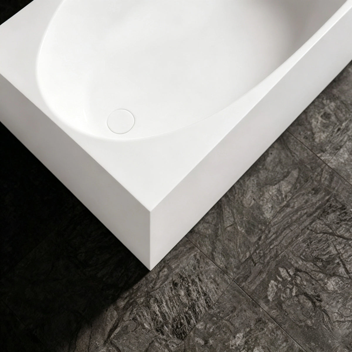 Close-up of the color-matched drain and wide rectangular rim.