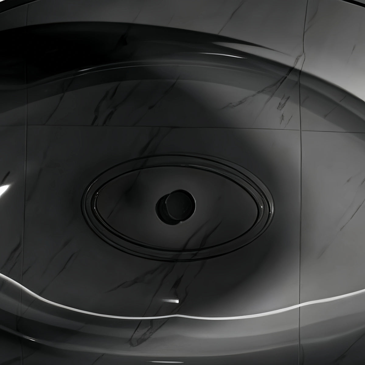 Top interior view of the transparent black bathtub basin and dark drain.
