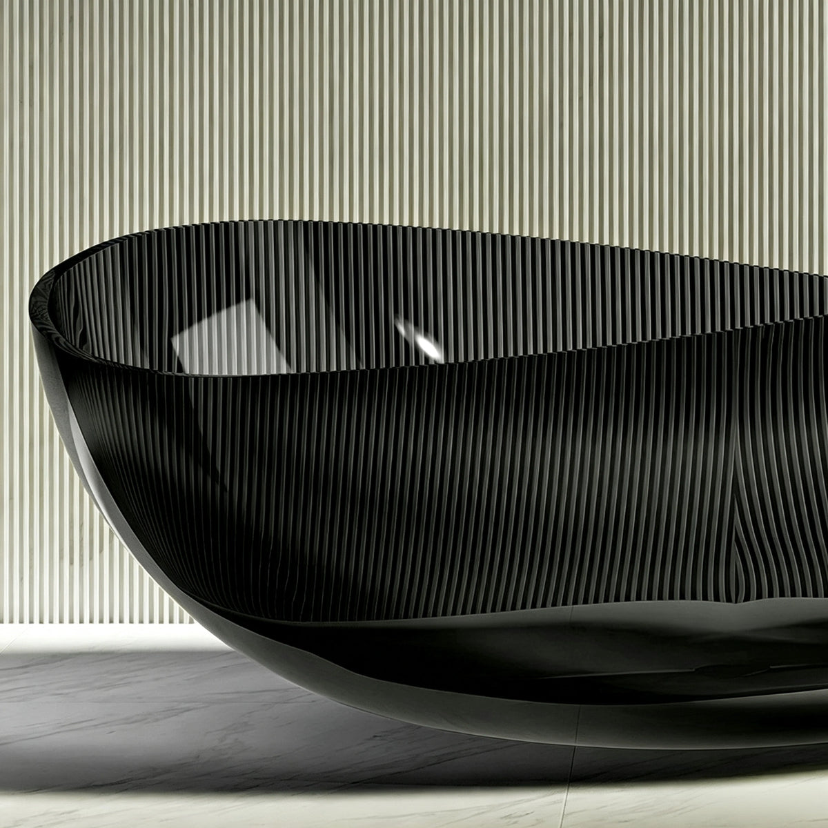 Side view showing the raised end and curved rim of the black bathtub.