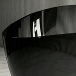 Close-up of the curved clear-edged rim and transparent black sidewall.