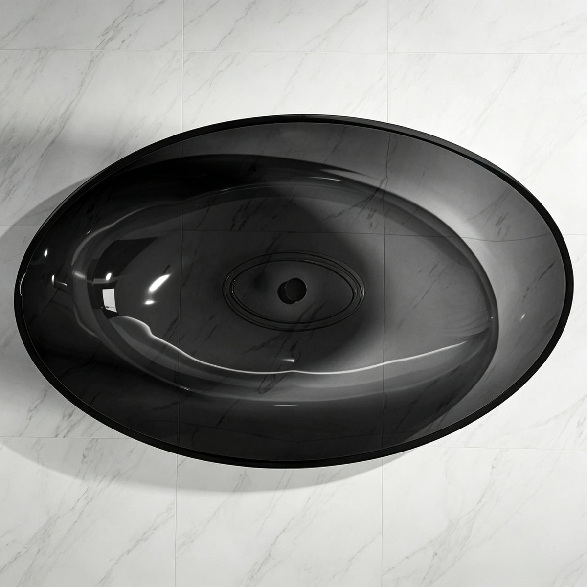 Top view into the oval basin of the transparent black resin bathtub.