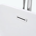 Close-up of built-in overflow cover on white freestanding tub