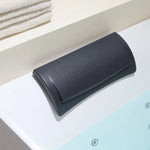 Close-up of soft black bathtub pillow matched with rectangular soaking tub