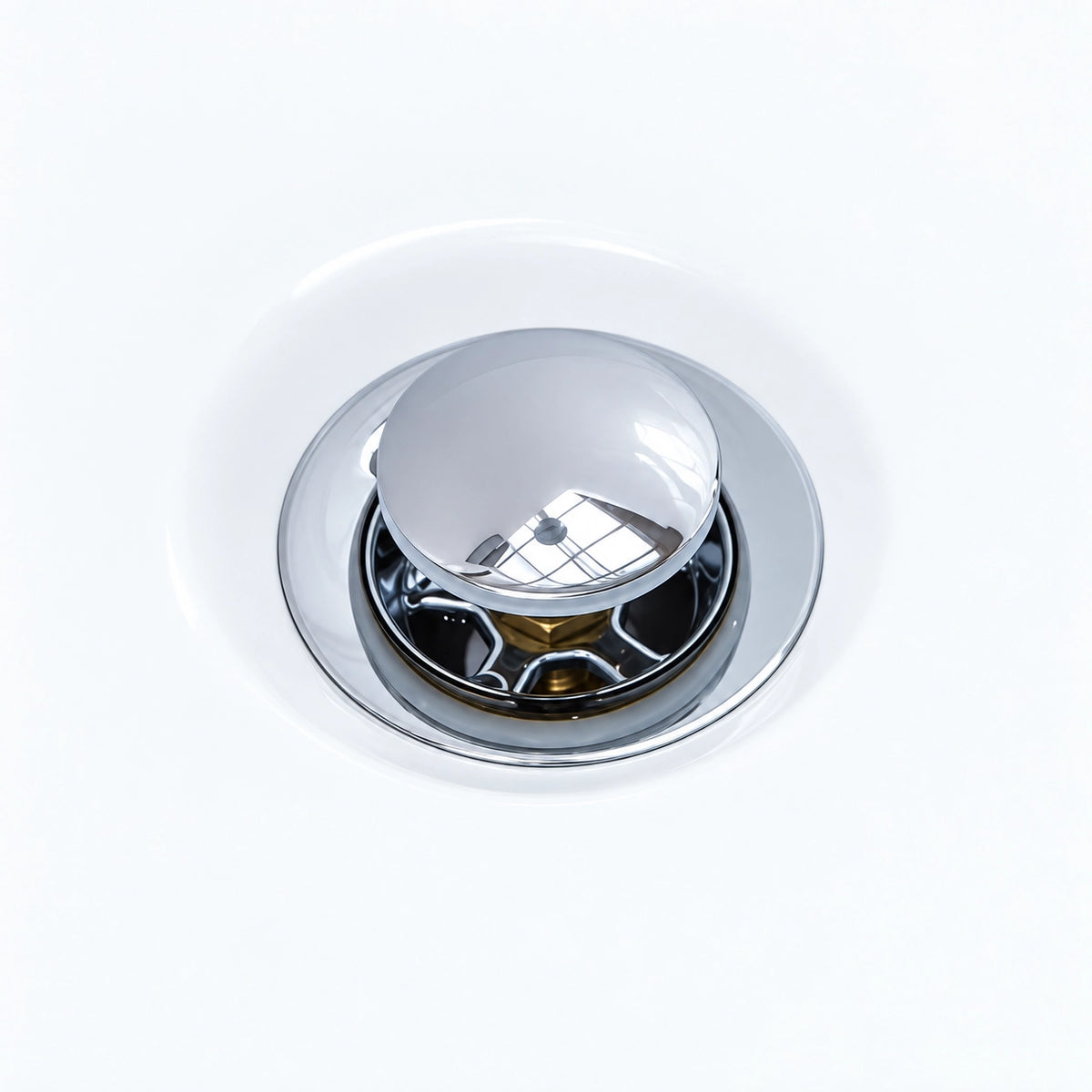 Close-up of chrome pop-up drain assembly for freestanding bathtub