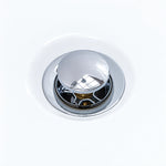 Close-up of chrome pop-up drain assembly for freestanding bathtub