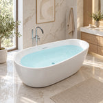 Oval freestanding soaking tub placed in bright marble bathroom with window view