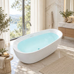 Freestanding soaking bathtub in luxury bathroom overlooking lake scenery