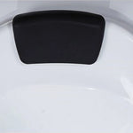 Close view of soft black bath headrest mounted inside white tub