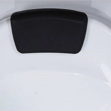 Close view of soft black bath headrest mounted inside white tub
