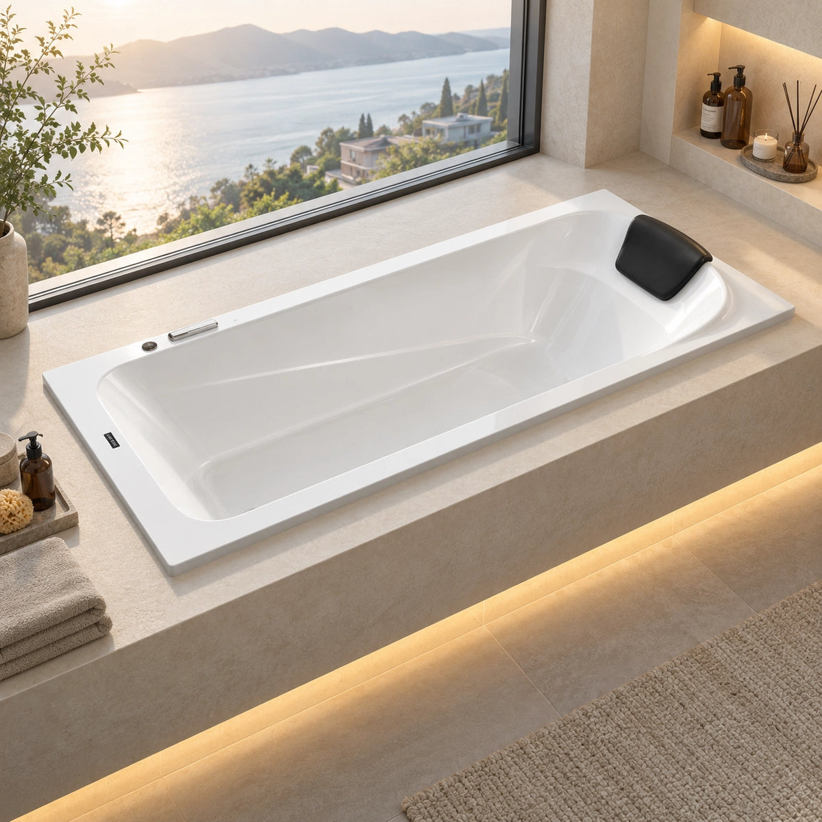 White drop-in soaking tub with black headrest in bathroom with sea view window