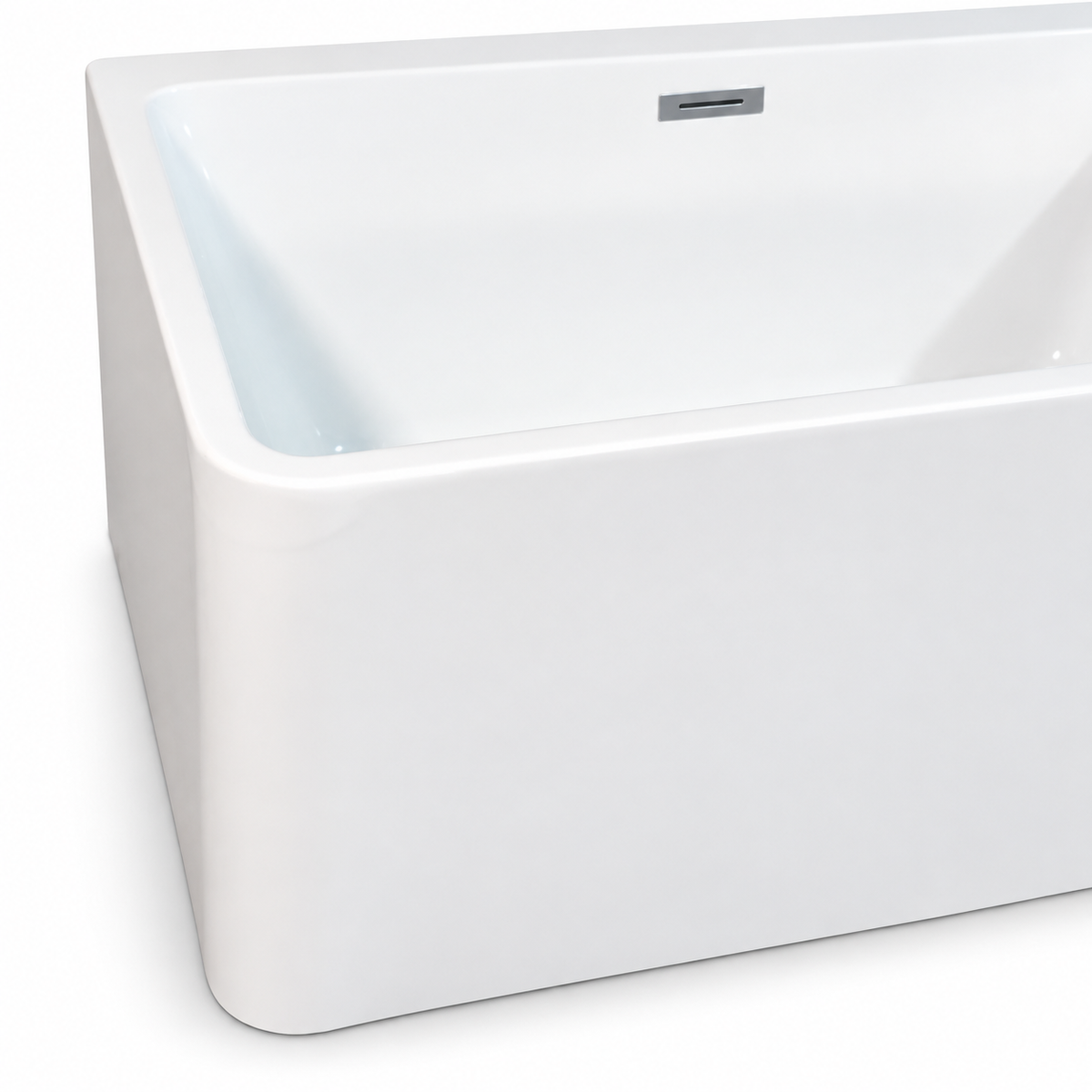 Close-up corner view of glossy white freestanding bathtub with overflow slot