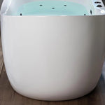 Side close-up of glossy white oval bathtub exterior