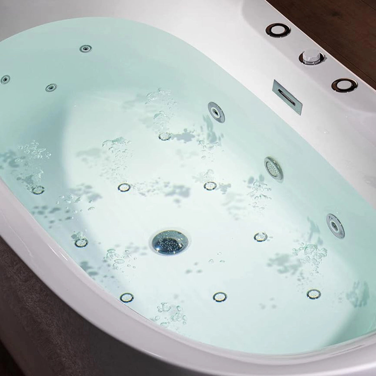 Close-up of bathtub interior, showing massage jets and water bubbles