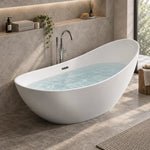 White boat-shaped freestanding tub filled with water in bright stone tile bathroom