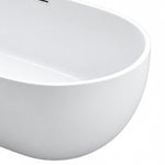 Close shot of bathtub rim and curved smooth outer wall surface
