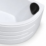 Close-up view of the tub's black headrest and curved front panel with layered grooves