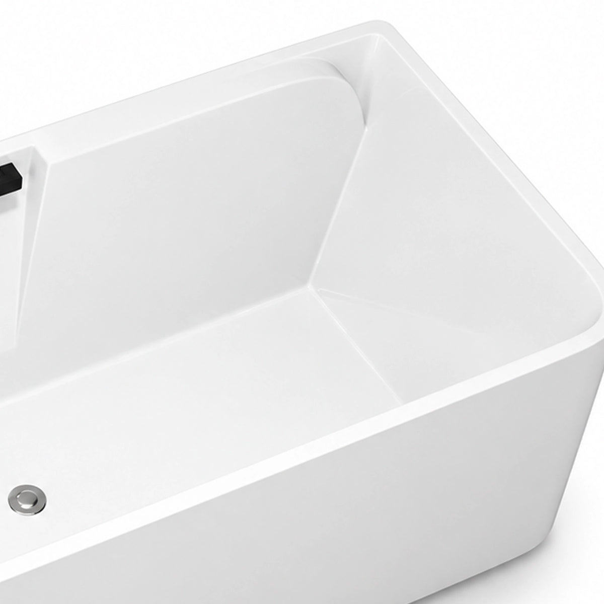 Close-up of tub inner basin, smooth glossy white surface, sloped backrest and drain outlet