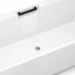 Close-up of built-in black grab handle on tub inner wall and central drain