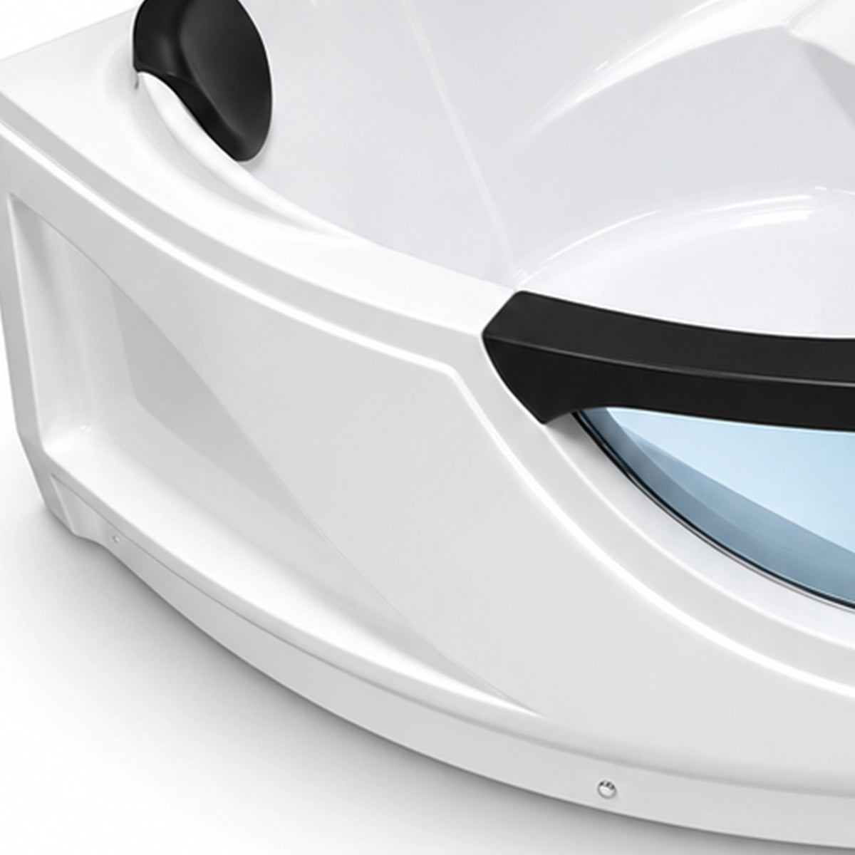 Close-up of bathtub corner, black headrest and glossy white acrylic shell