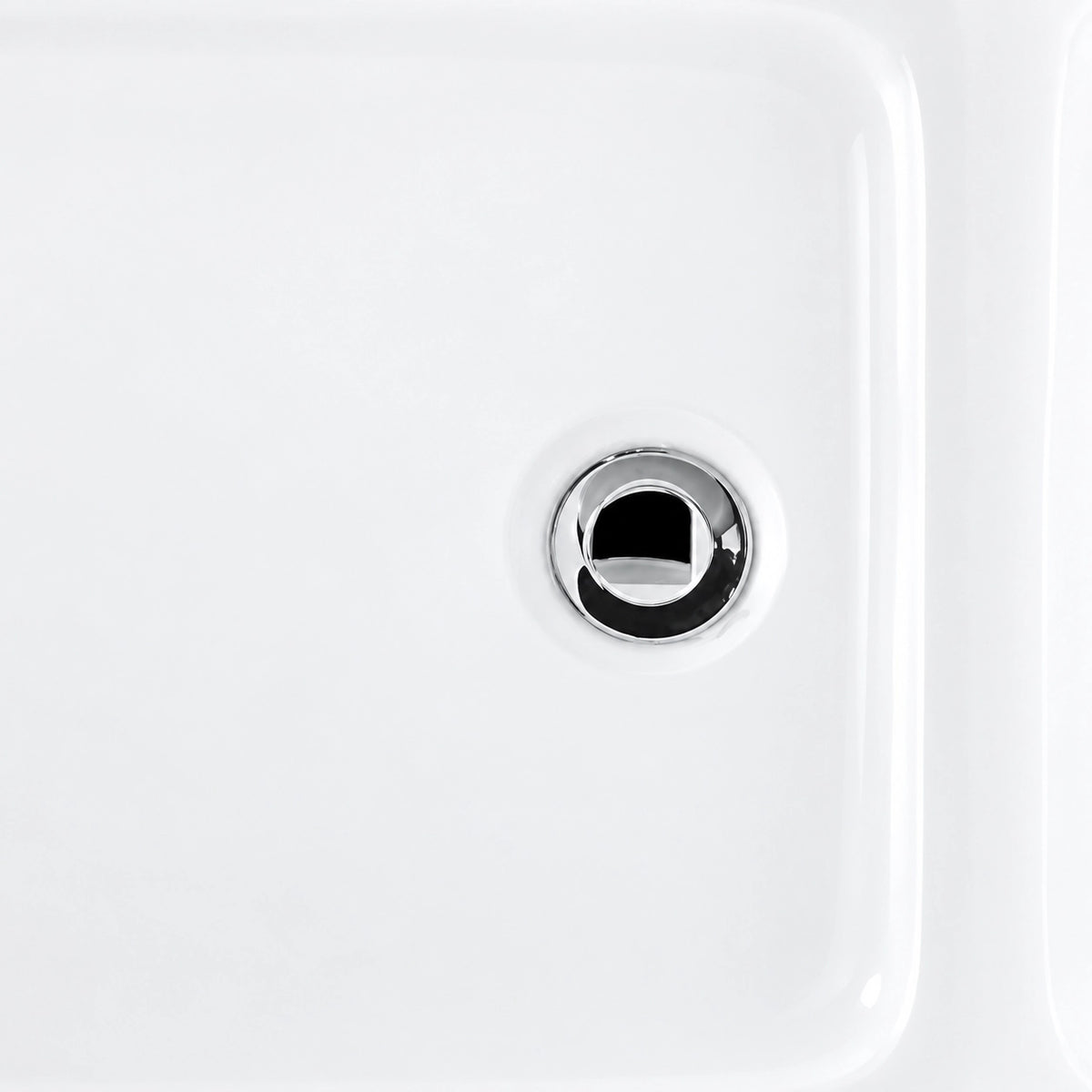 Bathtub drain detail, polished chrome drain on white tub interior