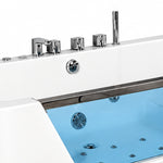 Close-up of bathtub chrome faucet, control knobs and hydro jets behind transparent glass panel