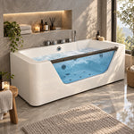 White freestanding whirlpool tub with transparent glass panel, placed in bright marble bathroom with niche shelf