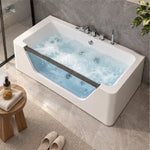 Overhead view of rectangular acrylic massage tub with water jets inside modern tiled bathroom