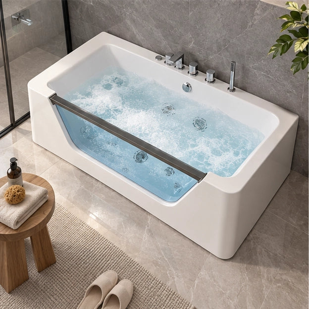 Overhead view of rectangular acrylic massage tub with water jets inside modern tiled bathroom