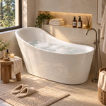 Curved freestanding tub filled with water, sunlit bathroom with wooden stool and plants