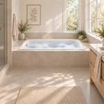 Drop‑in bathtub fitted in sunlit light beige tiled bathroom