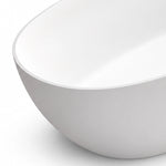 Close-up view of solid surface tub rim, smooth curved bathtub body