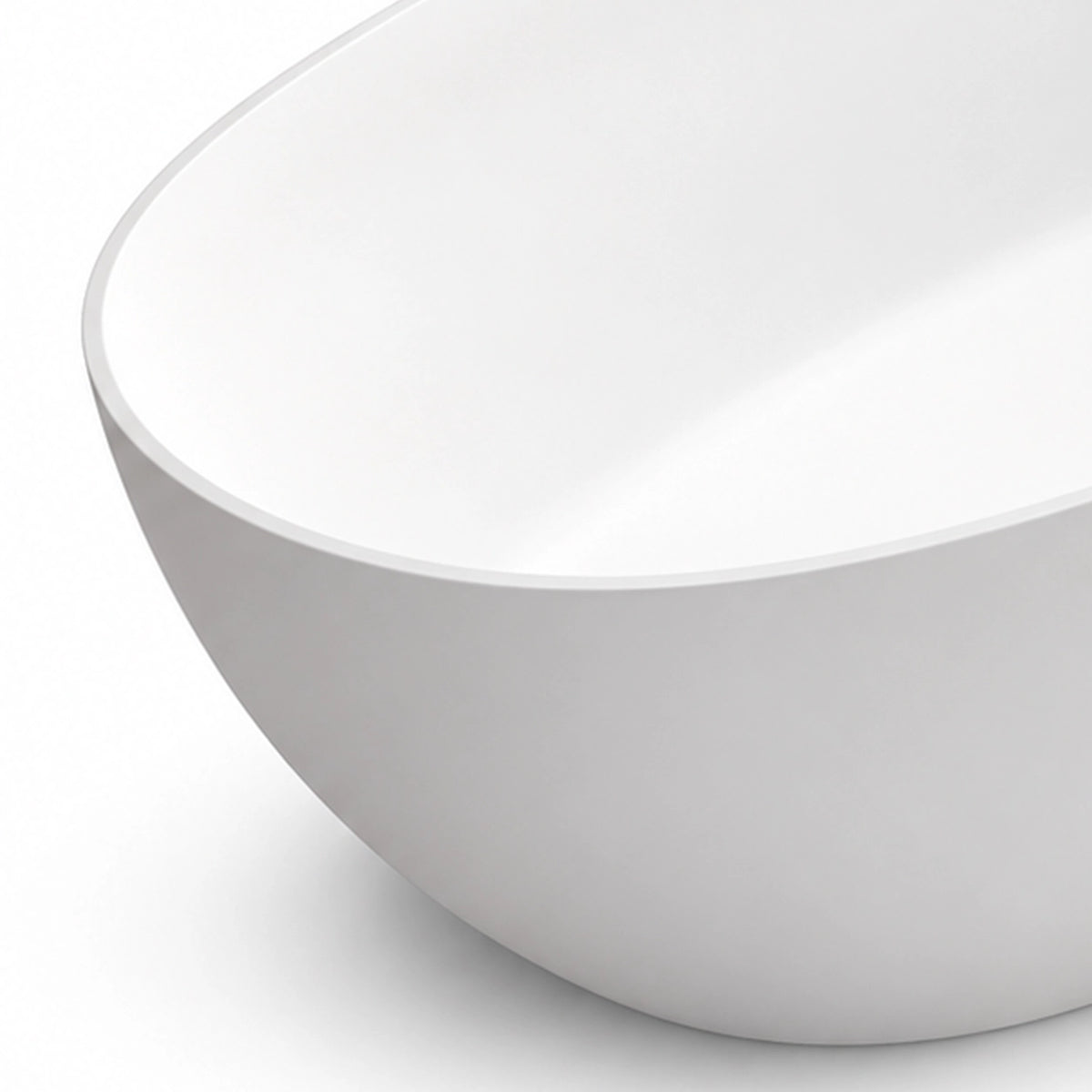 Close-up view of solid surface tub rim, smooth curved bathtub body