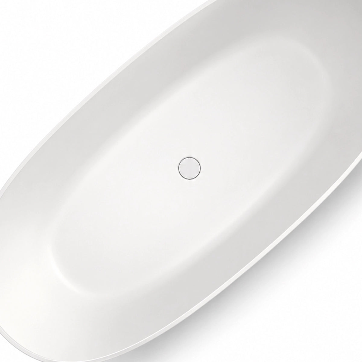 Top close-up of bathtub interior, showing bottom drain and smooth inner wall